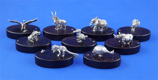 A set of nine modern Zimbabwean sterling silver menu holders by Patrick Mavros, each modelled as a wild creature,